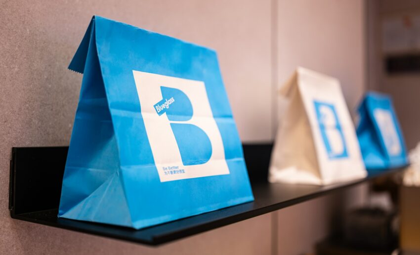 a blue bag sitting on top of a shelf